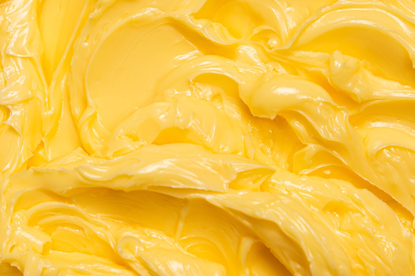 Close view of freshly churned Red Feather butter, thick and golden