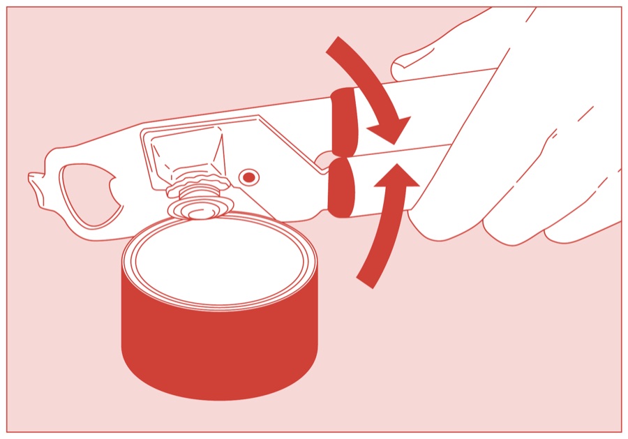 Hands pressing the can opener handles together to puncture the lid