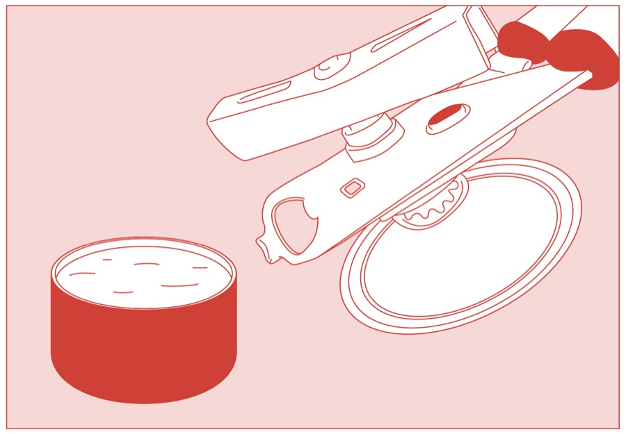 The lid lifted clear of the open tin of butter